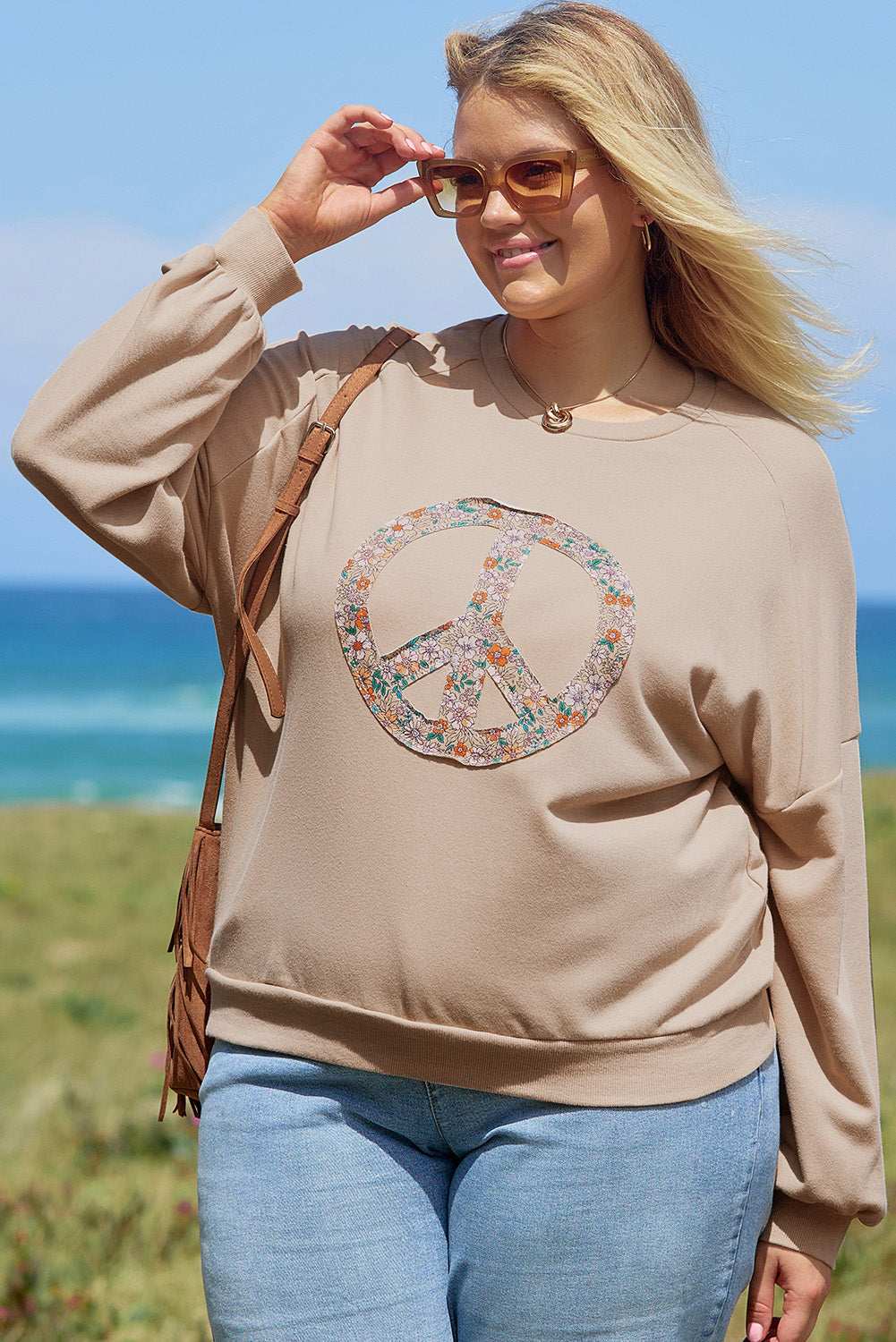 A pale khaki plus-size sweatshirt featuring a floral peace sign graphic and a Washed Terry Finish