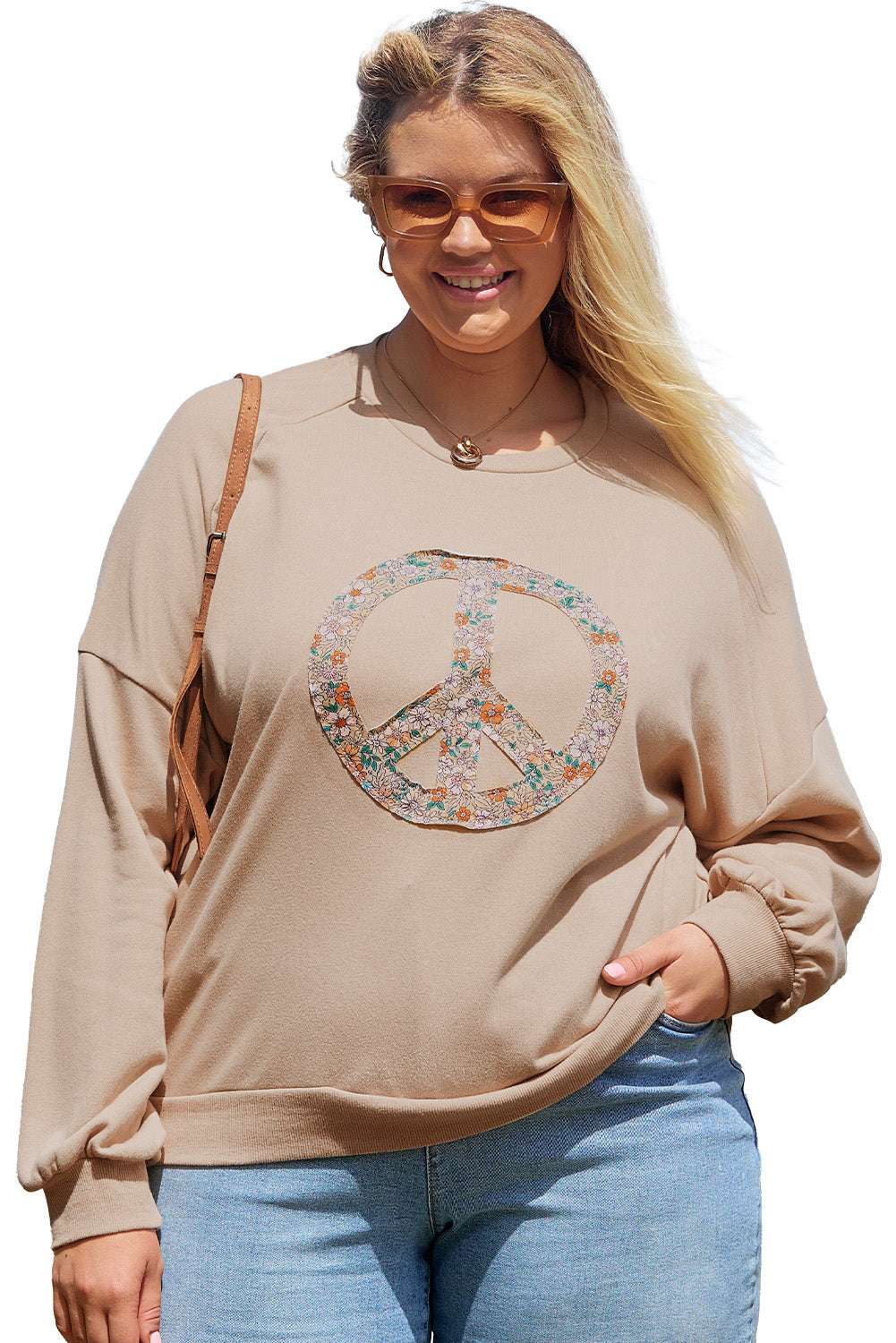 A pale khaki plus-size sweatshirt featuring a floral peace sign graphic and a Washed Terry Finish