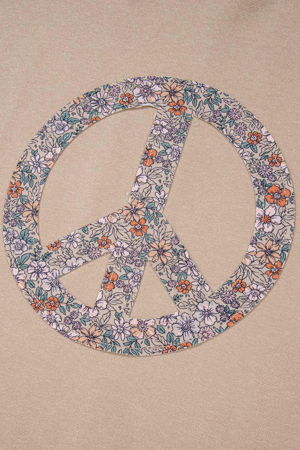 A pale khaki plus-size sweatshirt featuring a floral peace sign graphic and a Washed Terry Finish